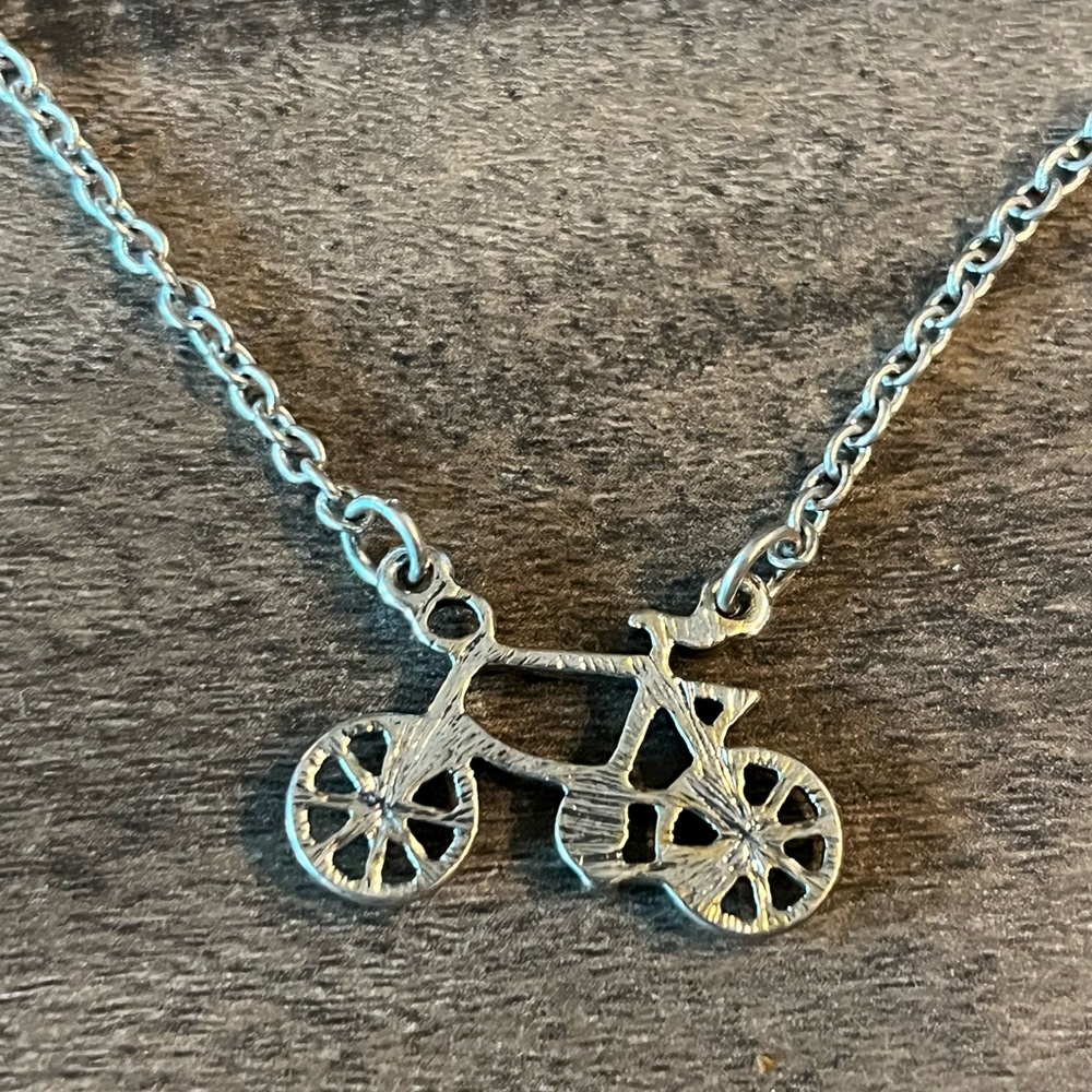 Unique bicycle necklace. Adjustable length - never worn.